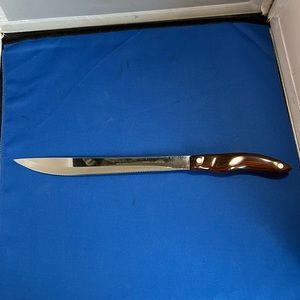CUTCO 1023   Carving Knife - Brown Swirl Handle 9" Blade.